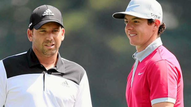 Sergio Garcia of Spain (L) and Rory McIlroy of Northern Ireland wait together on the third tee during the third round of the BMW Championship.