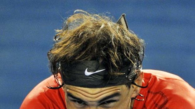 Rafael Nadal ponders defeat.