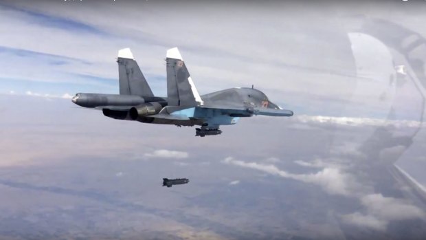 A bomb is released from a Russian Su-34 strike fighter in Syria in a video posted on Friday. 