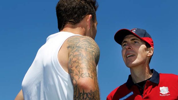 Inspirational: Jim Stynes gives Mitch Clark his old number yesterday.