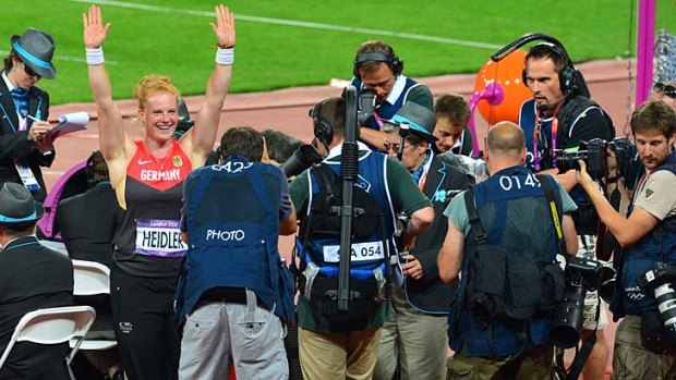 All's well that ends well ... Germany's bronze medalist Betty Heidler celebrates her medal.