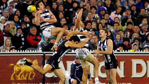 Geelong's Daniel Menzel takes a mark in the last quarter.