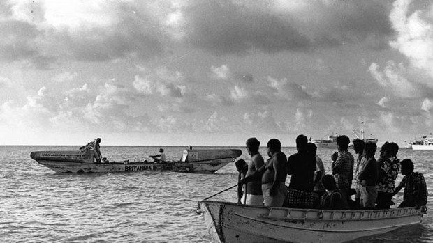Fairfax and Cook leave the Gilbert Islands on their way to Australia by rowboat.