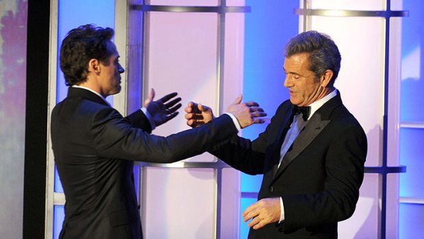 Mel Gibson presents Robert Downey Jr. with his American Cinematheque Award on Friday night.