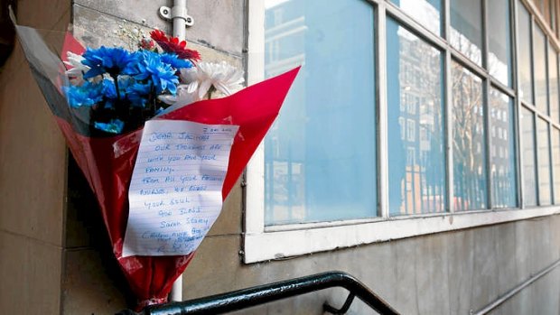 A bunch of flowers is left outside the nurses accommodation block by colleagues near the King Edward VII hospital in central London on in memory of nurse Jacintha Saldanha, who was found dead the previous day.