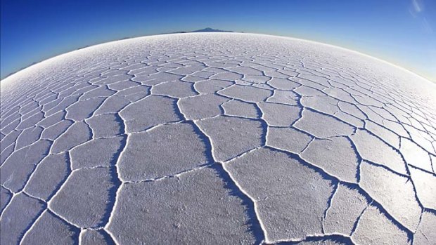 Geometric shapes on the salt flat's vast surface.