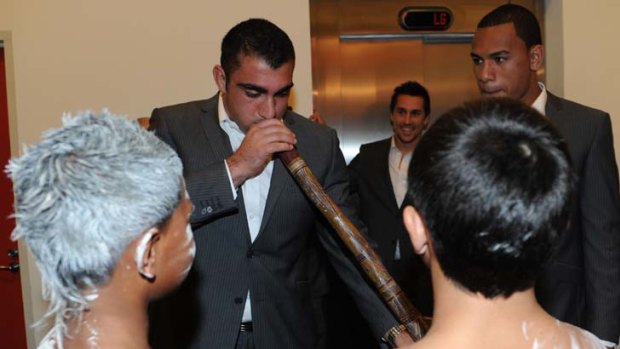 Ridgy didge Blues ... NSW players Tim Mannah and Will Hopoate give the didgeridoo a try at a dinner for indigenous teenagers.