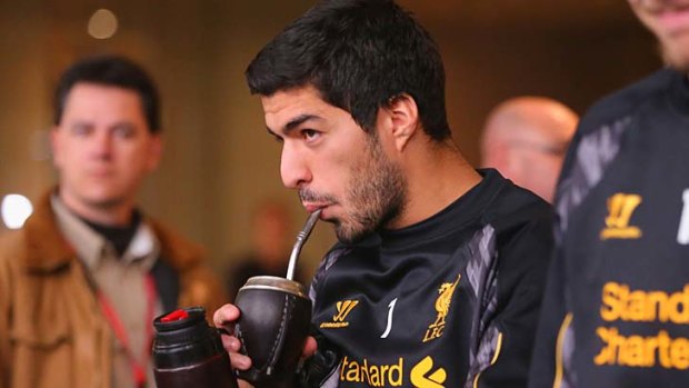Champing at the bit: Liverpool striker Luis Suarez in Melbourne on Monday.