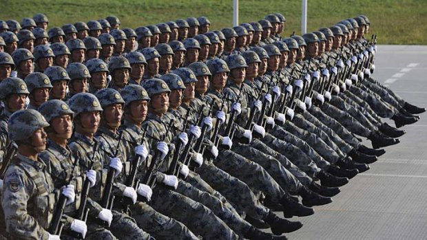 Soldiers from the Chinese People's Liberation Army (PLA) Airborne Corps march in formation during a training session at the 60th National Day Parade Village in the outskirts of Beijing, September 15, 2009. China will celebrate the 60th anniversary of its founding on October 1 this year. Picture taken September 15, 2009.