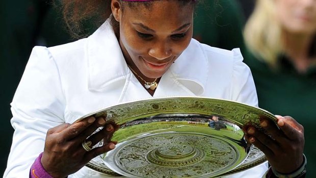 Triumph ... Serena Williams celebrates her fifth Wimbledon title.