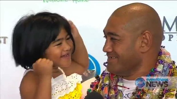 Logan boxer Alex Leapai fronts the media with his daughter.