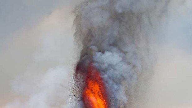 Fire power ... Virunga National Park is inviting tourists on an overnight trek to view a spectacular eruption of Mount Nyamulagira, where rivers of lava pose no danger to its critically endangered mountain gorillas.