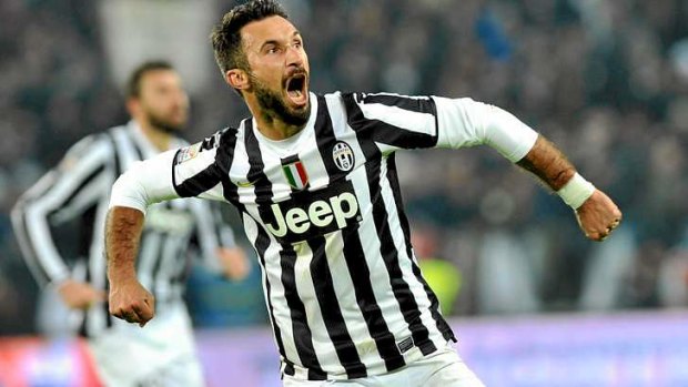 Juventus forward Mirko Vucinic celebrates after scoring.
