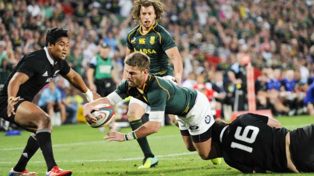 South Africa winger Willie le Roux crosses for a try.