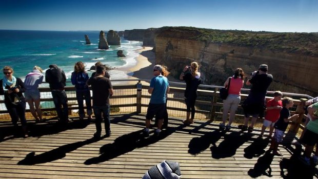 Tourists visit the iconic Twelve Apostles on the Great Ocean Road.