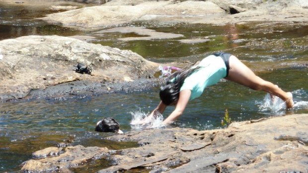 Cooling off in the rockpools atop Carrington Falls