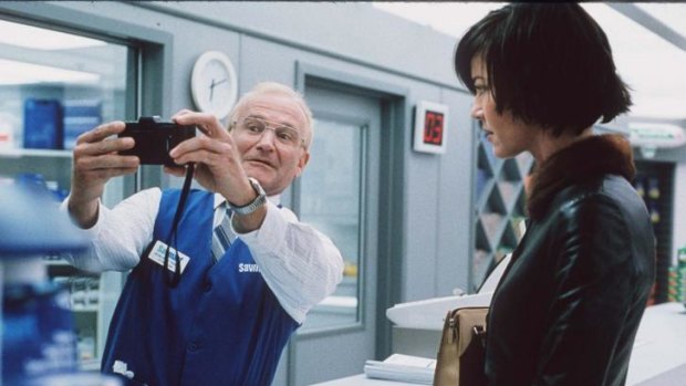 Outstanding performance ... Robin Williams, left, as the photo lab technician Seymour Parrish who becomes obsessed with a young family in 'One Hour Photo'. Connie Nielsen plays the mother, Nina Yorkin.