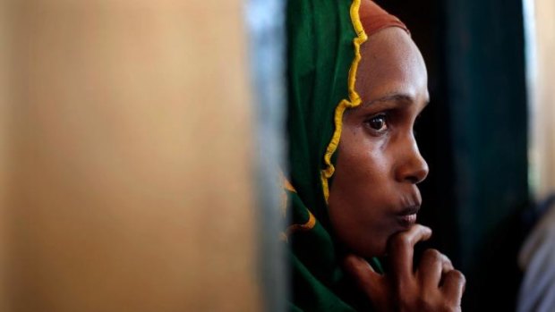 A Peul woman listens to a town meeting between Muslim clerics and community leaders in an Islamic centre where Peul refugees have sought protection in Bangui.