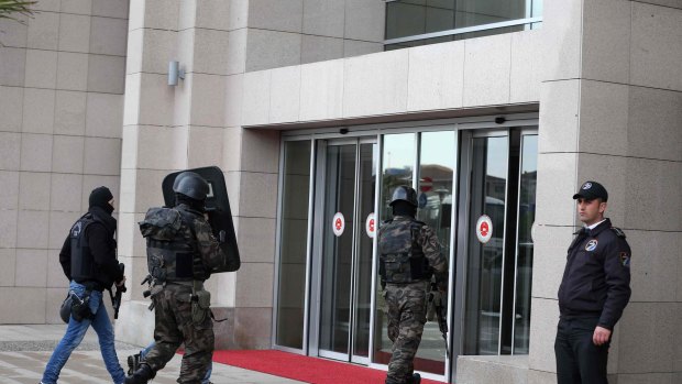 Members of special security forces enter  the main courthouse in Istanbul, Turkey.