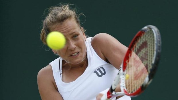 Barbora Zahlavova Strycova of the Czech Republic hits a return to Caroline Wozniacki of Denmark during their singles match at Wimbledon on Monday.