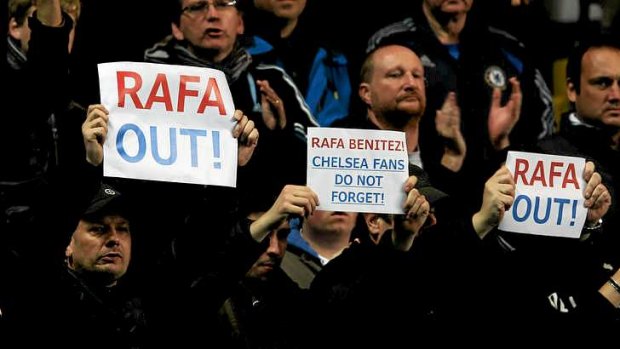 Fans holding up signs calling for the departure of Rafael Benitez from Chelsea.