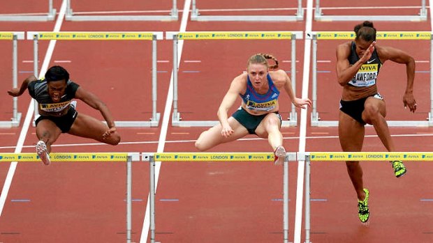Kellie Wells of the USA (left) beats Sally Pearson (centre) in the 100m hurdles at Crystal Palace earlier this month.