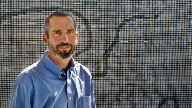 Artist Ned Kahn infront of the giant artwork at the Brisbane Airport's new car park.