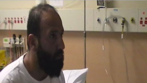 A police video still from when Monis is told while in hospital that his ex-wife is dead.