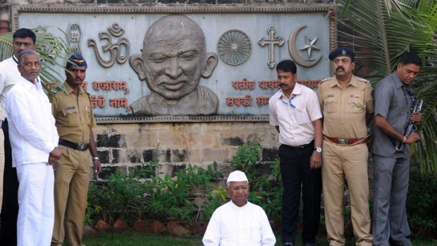Indian activist Anna Hazare meditates at a memorial of his idol and India's father of the nation Mahatma Gandhi.