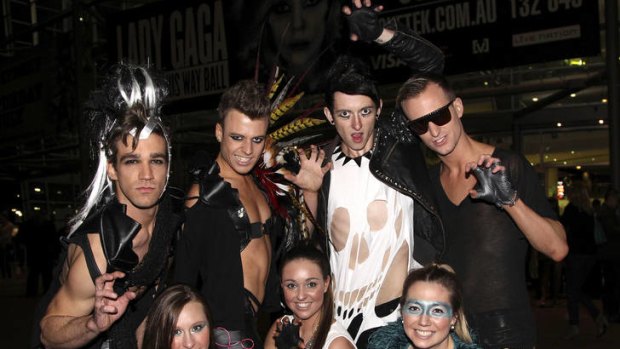 Fans dressed as Gaga's monsters pose for photos as they arrive for the Lady Gaga's concert in Sydney.