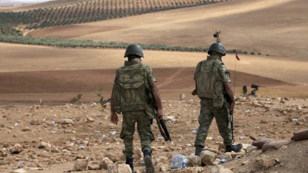 Turkish soldiers patrol for Islamic State militants to the west of Kobani.