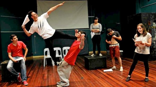 The cast of <i>The Violence Project</I>, which includes 9Lives acrobatic performers, in rehearsal.