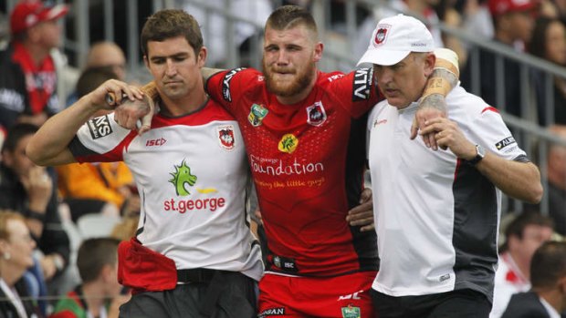 St George Illawarra Dragons fullback Josh Dugan is carried off the field during the Charity Shield clash with South Sydney at WIN Stadium.