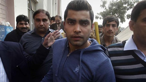 Pakistan cricketer Umar Akmal arrives at a court in Lahore on Sunday in connection with having allegedly slapped a traffic sergeant after not obeying a traffic signal.
