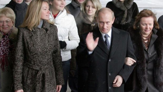 Vladimir Putin with his daughter Maria, left, and then wife Ludmilla, in 2007.