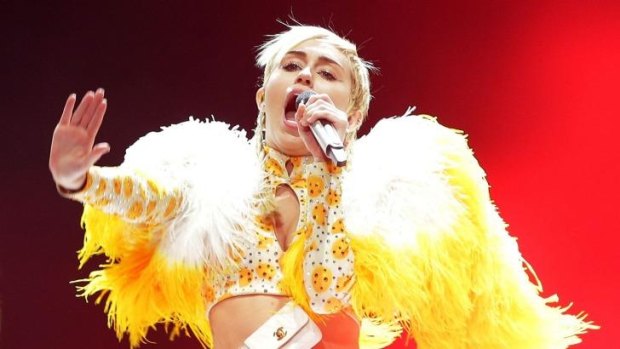 Using the spotlight to say something ... Miley Cyrus performs her Bangerz Tour in Australia in 2014.