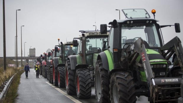 A convoy of farmers help blockade the main road into the Port of Calais as they protest against "The Jungle".