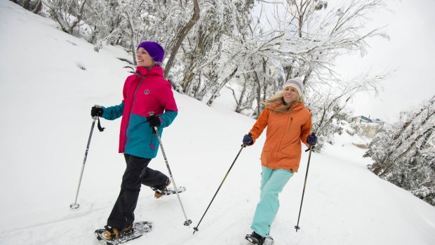 Mt Buller residents Gillian Dobson and Niki Donaldson enjoy a fresh and scenic snowshoe walk around the village. Photo:  Andrew Railton