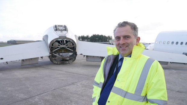 Miles Carden, aerohub enterprise zone manager, poses in from of aeronautical equipment at Cornwall Airport, Newquay.