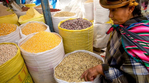 A woman shops for food at a grain market, in La Paz, Bolivia. While the Incas relied on quinoa to feed their soldiers, it has only recently been grown for export.