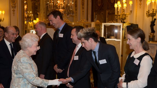 A firm supporter of popular culture, the Queen shook hands with Niall Horan of One Direction last year. Photo: Getty Images