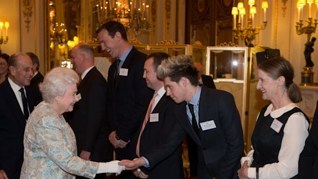 A firm supporter of popular culture, the Queen shook hands with Niall Horan of One Direction last year. Photo: Getty Images