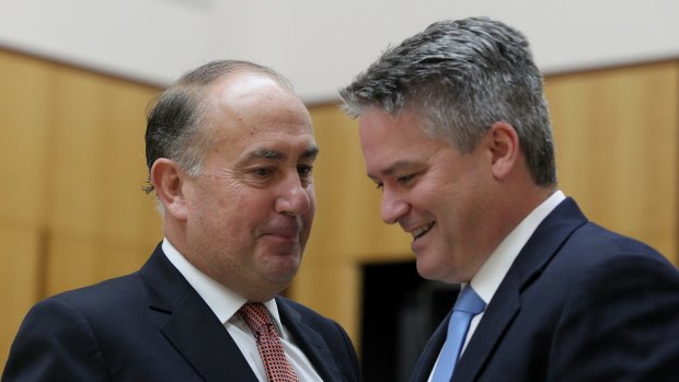 Secretary of Treasury John Fraser (left), pictured with Finance Minister Mathias Cormann, says it's time to adjust the tax system to the changing nature of the economy.