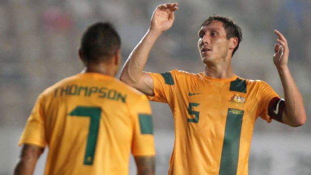 Australia's Mark Milligan reacts to a setback against Japan in South Korea.