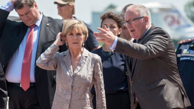 Dutch Foreign Minister Frans Timmermans (right) and his Australian counterpart Julie Bishop (centre) at Kharkiv airport in July.