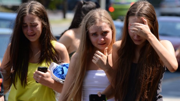 Teenagers walked through Surfers Paradise dazed and in tears on Friday, as they struggled to come to terms with Isabelle Colman's death.