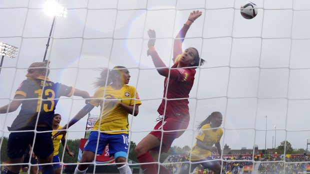 Australia's goalkeeper Lydia Williams (centre) makes a save against Brazil in the round of 16 match.