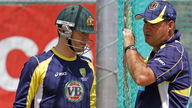 Michael Clarke and coach Mickey Arthur chat during a nets session.