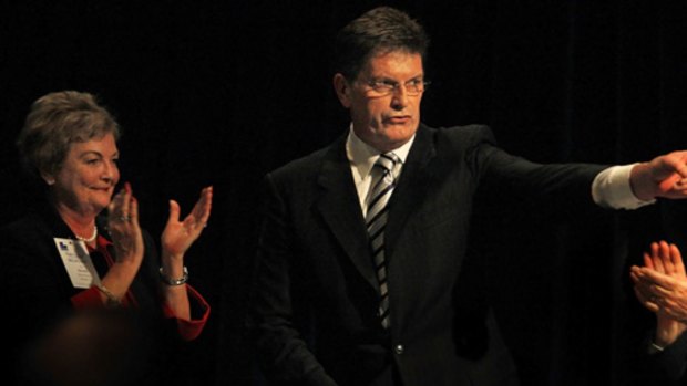 Victorian Liberal leader Ted Baillieu wins applause from state vice-president Sandra Mercer Moore and president David Kemp.