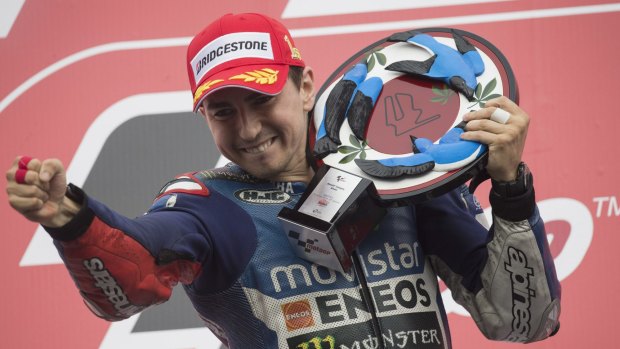 Jorge Lorenzo celebrates victory on the podium in Japan last weekend.